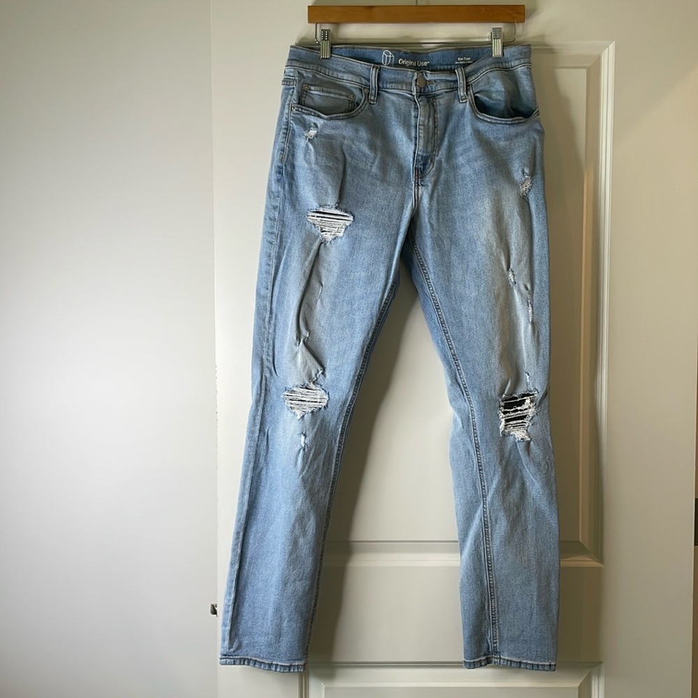 Ripped and frayed style blue jeans